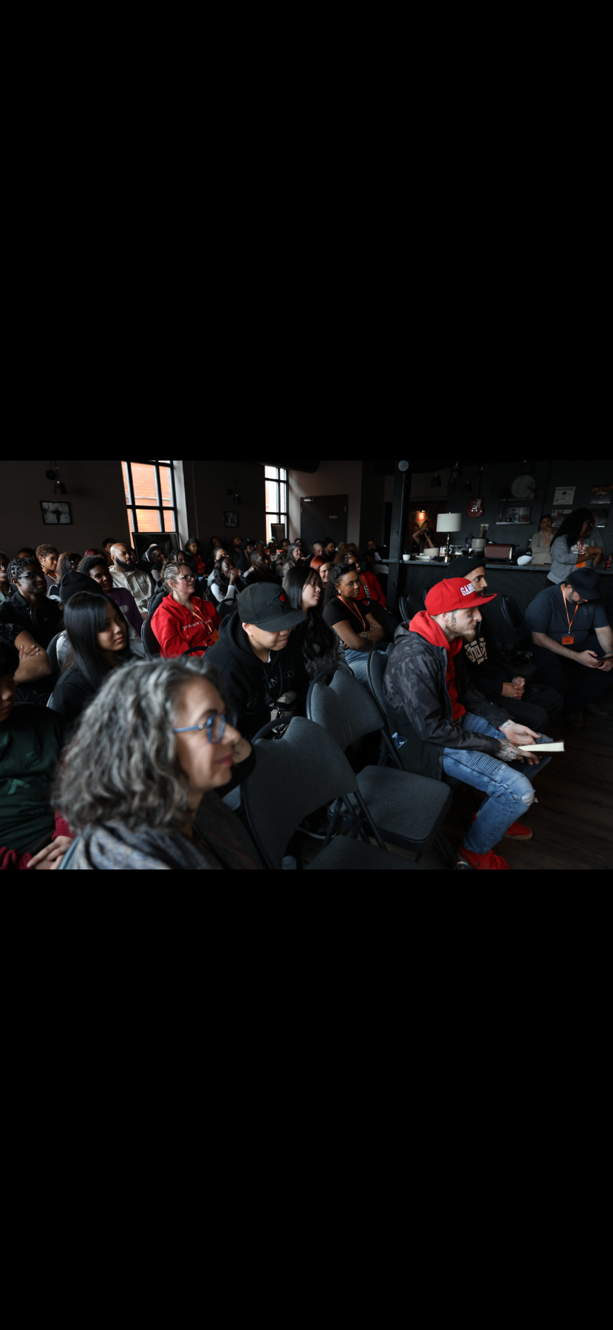 Guests listening intently during a Sunday gathering at Catalyst Church